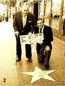 Robert and Richard at their Star on the Hollywood Walk of Fame holding their book, Walt's Time (1999)